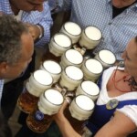 A waitress carries beer mugs during the opening of the 184th Oktoberfest beer festival in Munich, Germany, Saturday, Sept. 16, 2017. The world's largest beer festival will be held from Sept. 16 until Oct. 3. (AP Photo/Matthias Schrader)